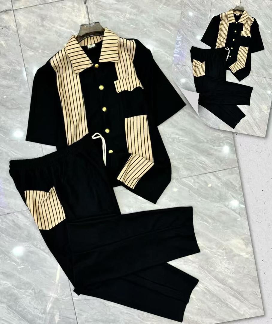 Black ribbed button-up shirt and pants two-piece set with beige stripes.
