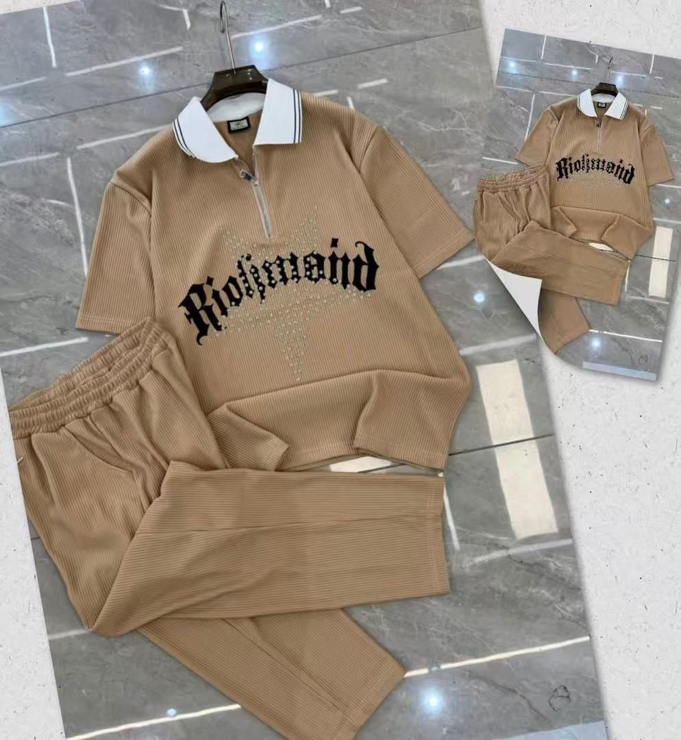 Beige ribbed zip polo and pants two-piece set with Richmond graphic on tiled floor.