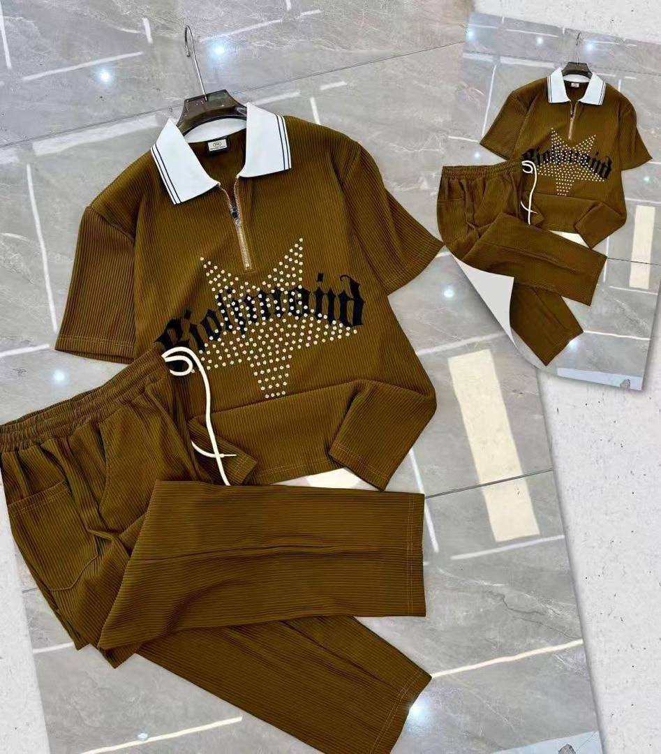 Brown ribbed zip polo and pants two-piece set with Richmond graphic on tiled floor.
