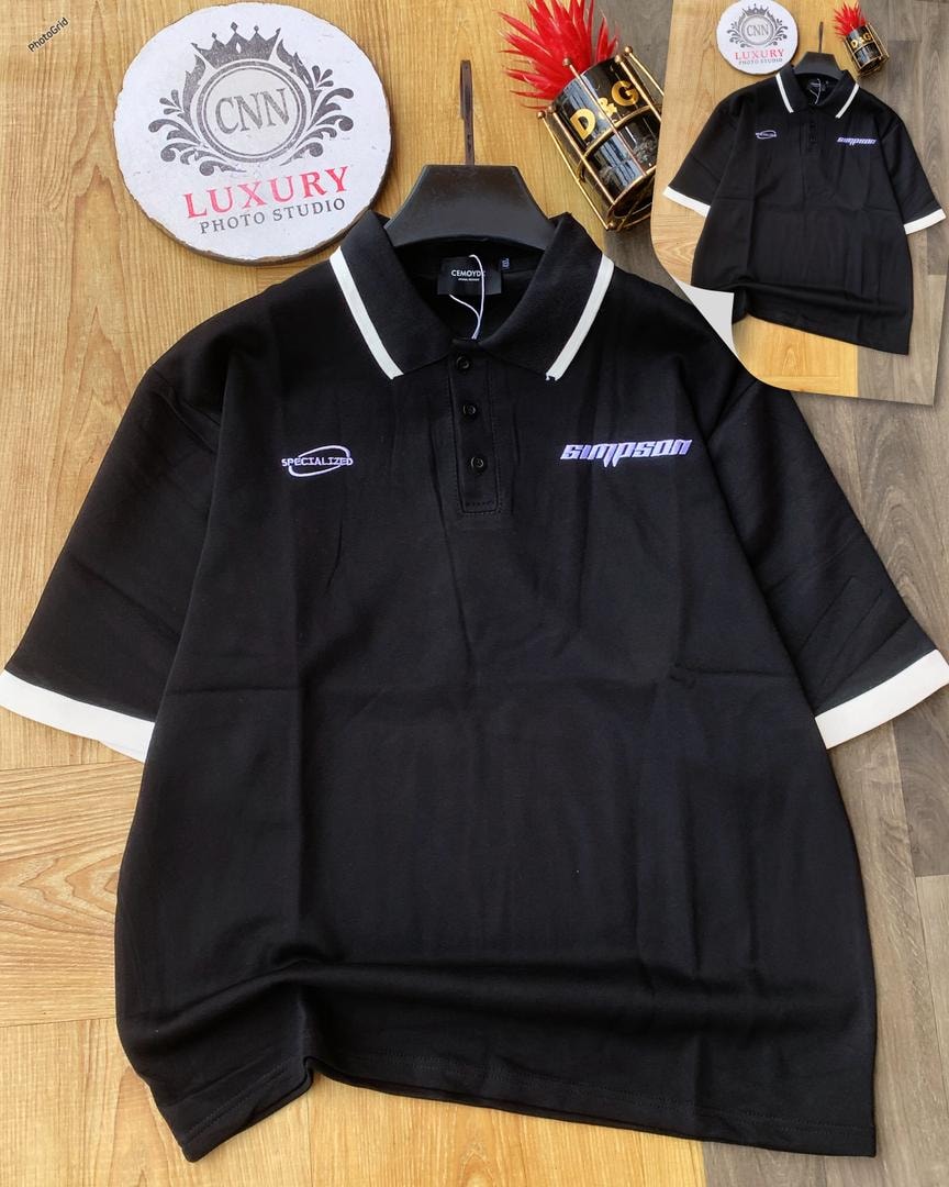 Black polo shirt with white contrast trim and chest embroidery.