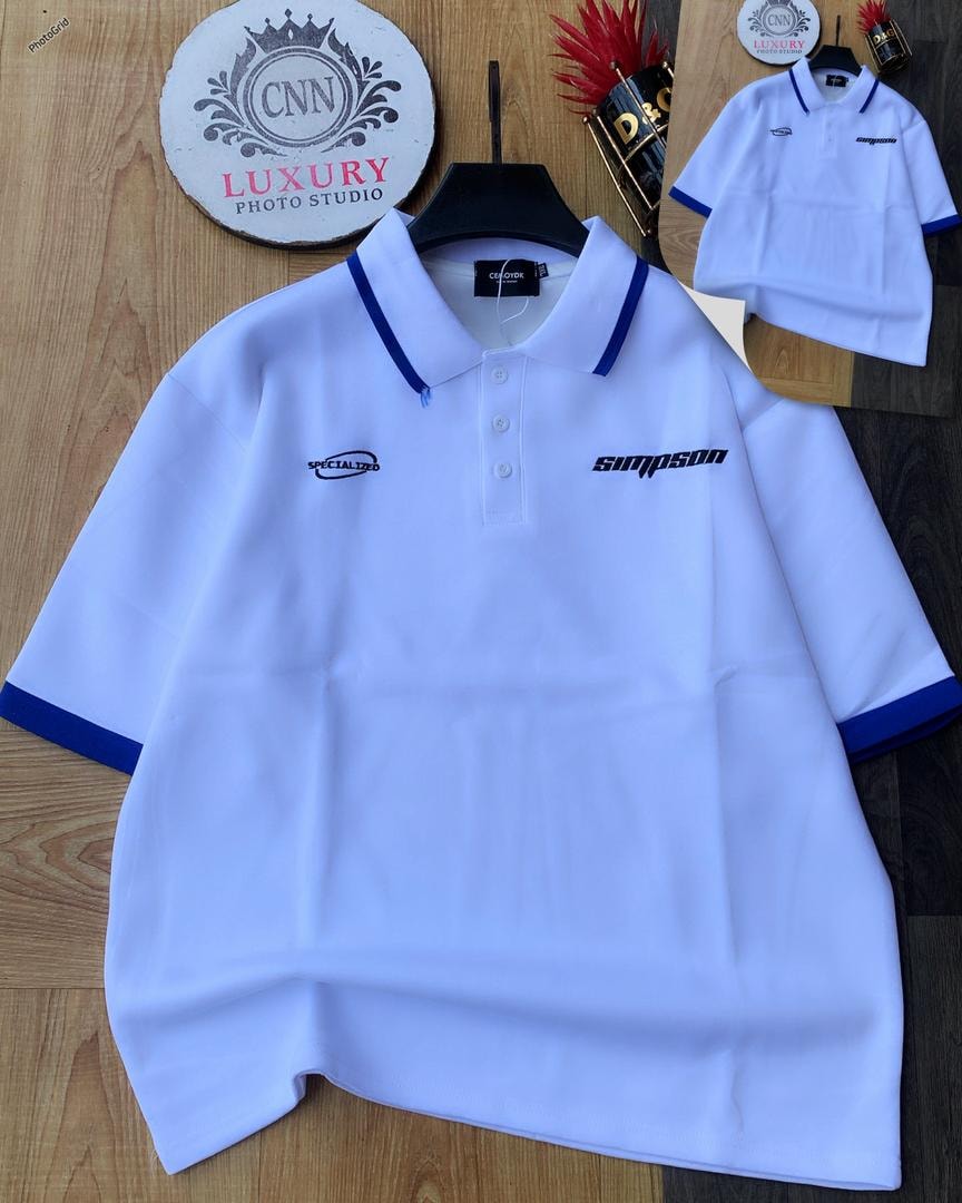 White polo shirt with blue contrast trim and chest embroidery.