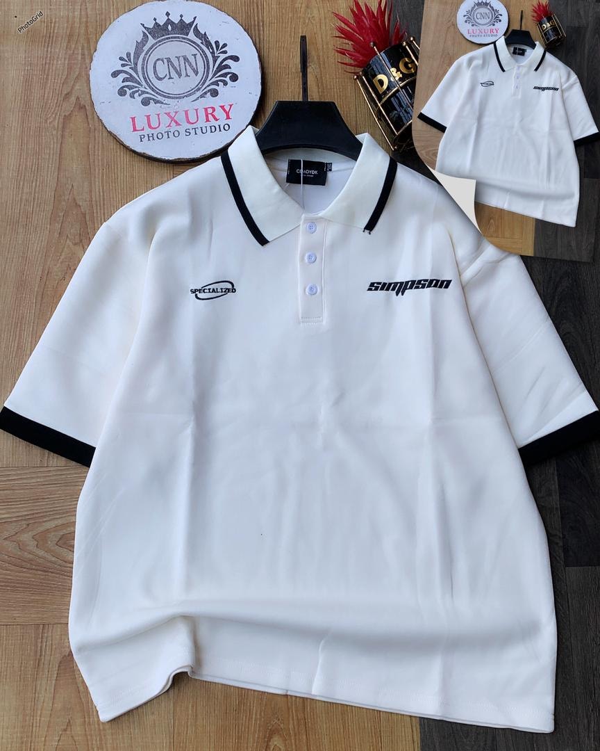 White polo shirt with black contrast trim and chest embroidery.