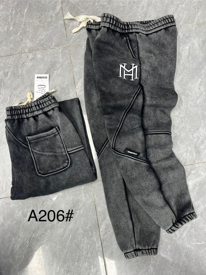 Gray MH Essentials logo joggers with pocket detail.