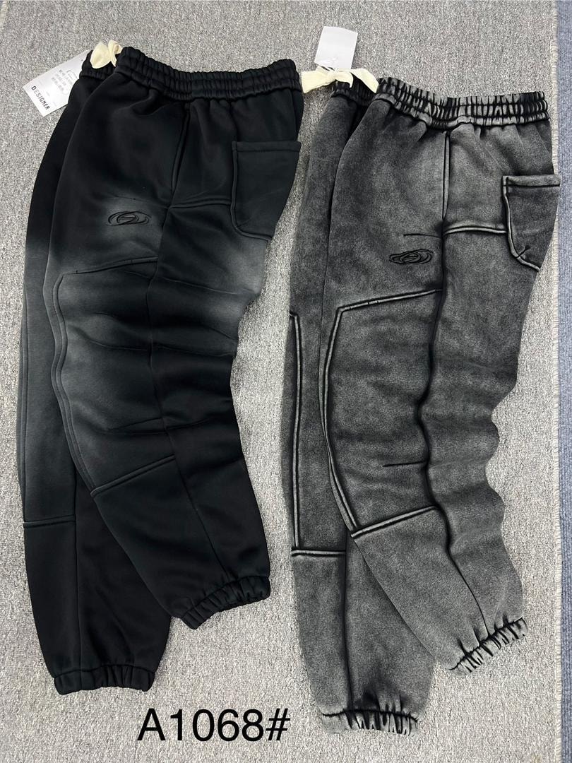 Black and gray embroidered cargo joggers displayed side by side.