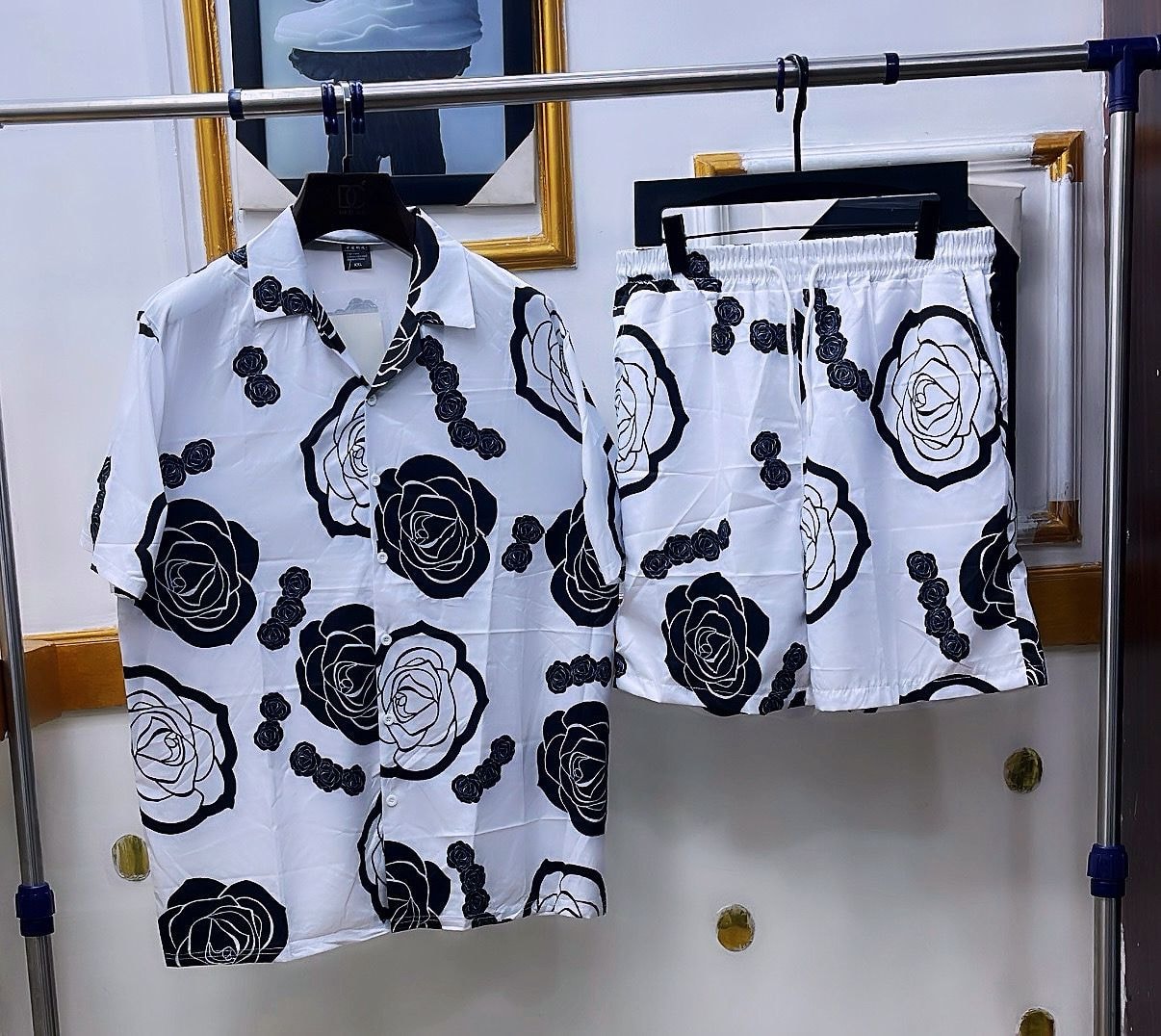 White shirt and shorts set with large black rose floral print.