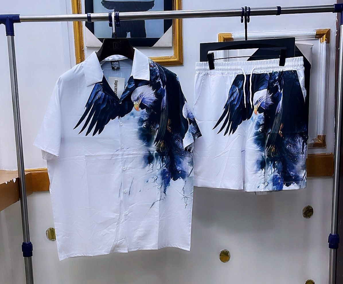 White shirt and shorts set with large blue eagle bird graphic.