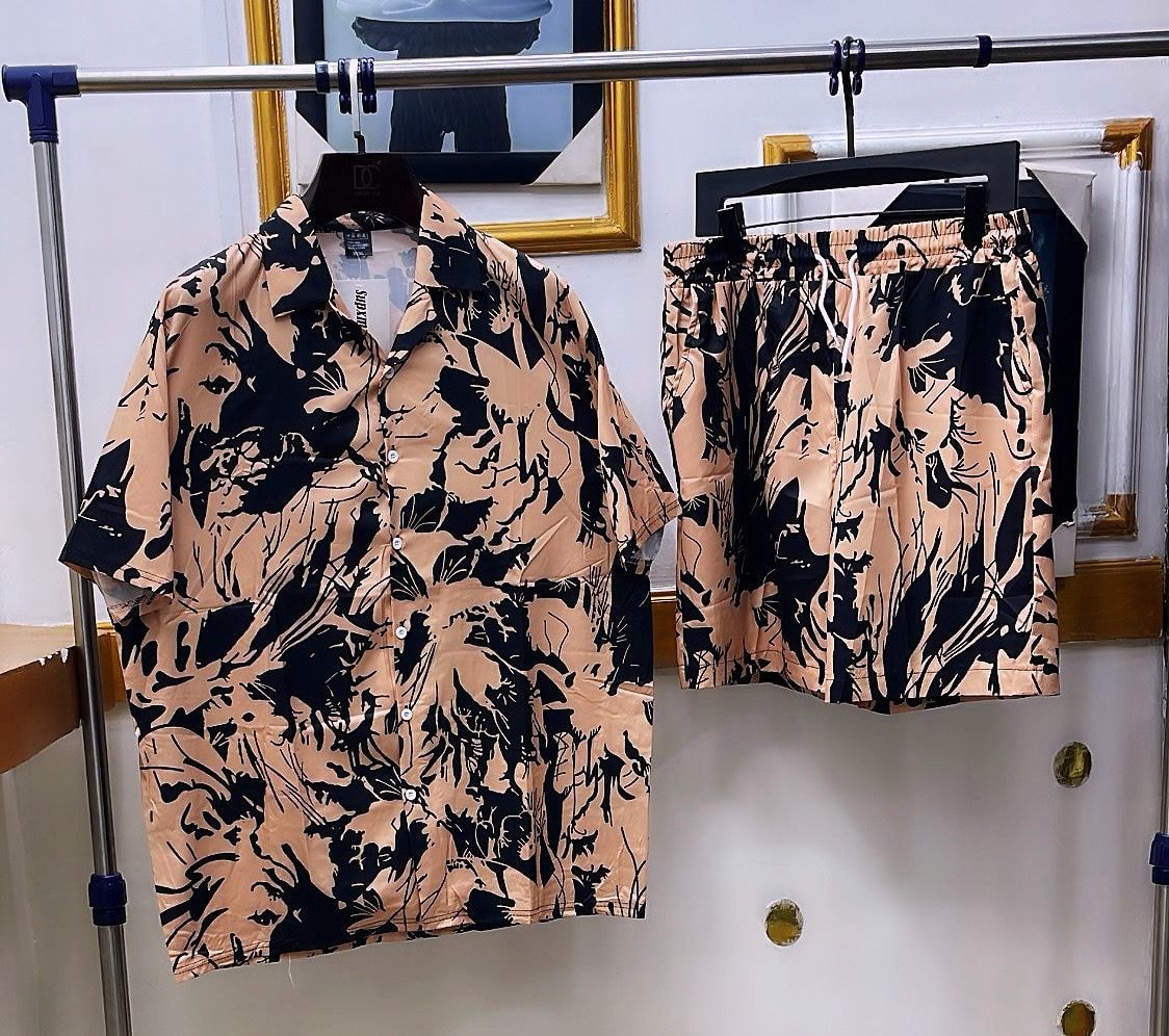 Beige shirt and shorts set with black abstract brushstroke print.