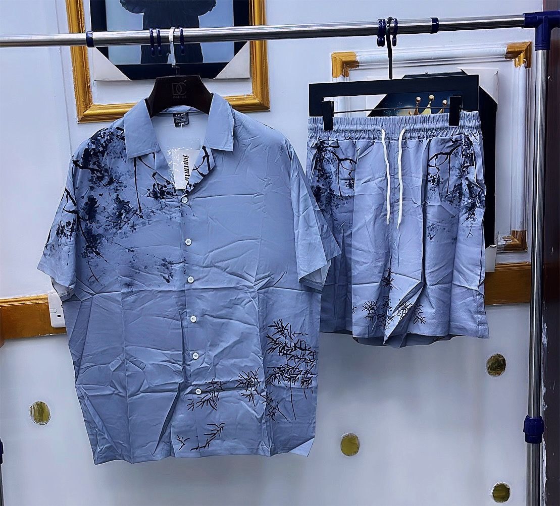 Light blue shirt and shorts set with black bamboo and ink splatter print.