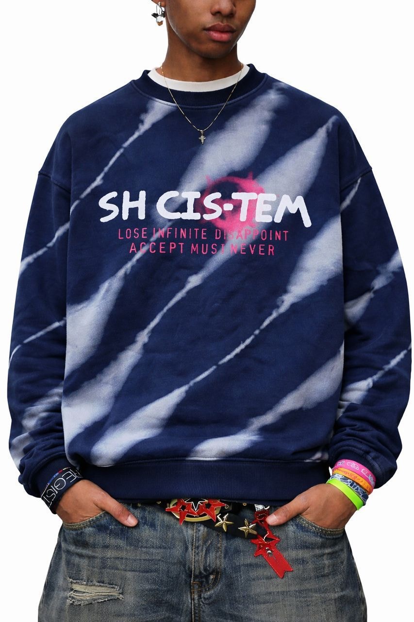 Model wearing navy tie-dye SH CIS-TEM sweatshirt with white streaks.
