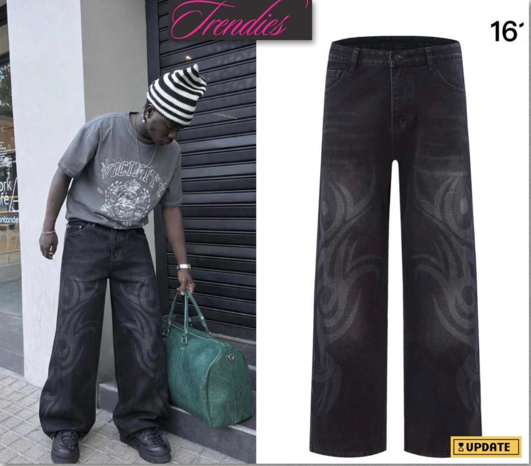 Black baggy jeans with gray flame and tribal swirl patterns on the legs.