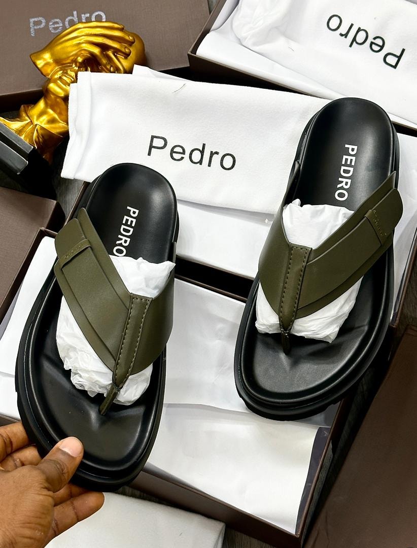 Olive Pedro thong sandals displayed in packaging with dust bag.