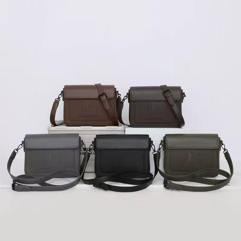 Five Tommy Angler crossbody bags displayed in brown, dark brown, gray, black, and olive colorways.