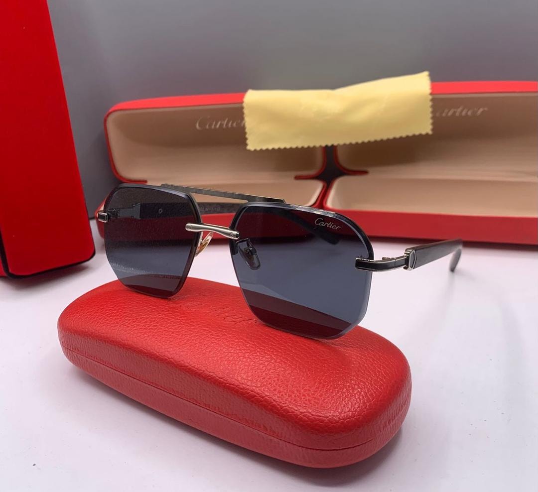Cartier square sunglasses with black lenses, black arms and gold details.