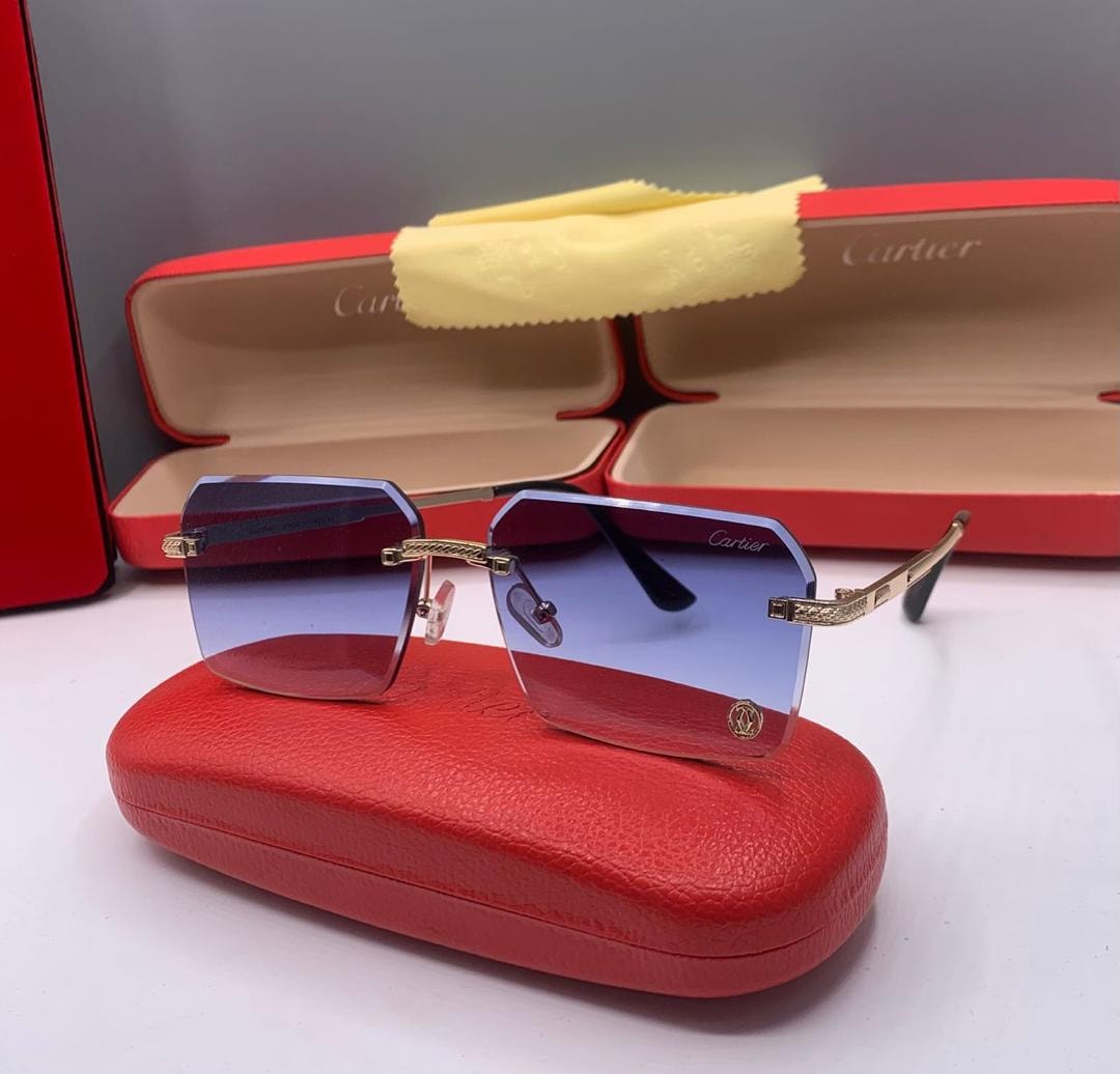 Cartier rimless sunglasses with blue gradient lenses on red case.