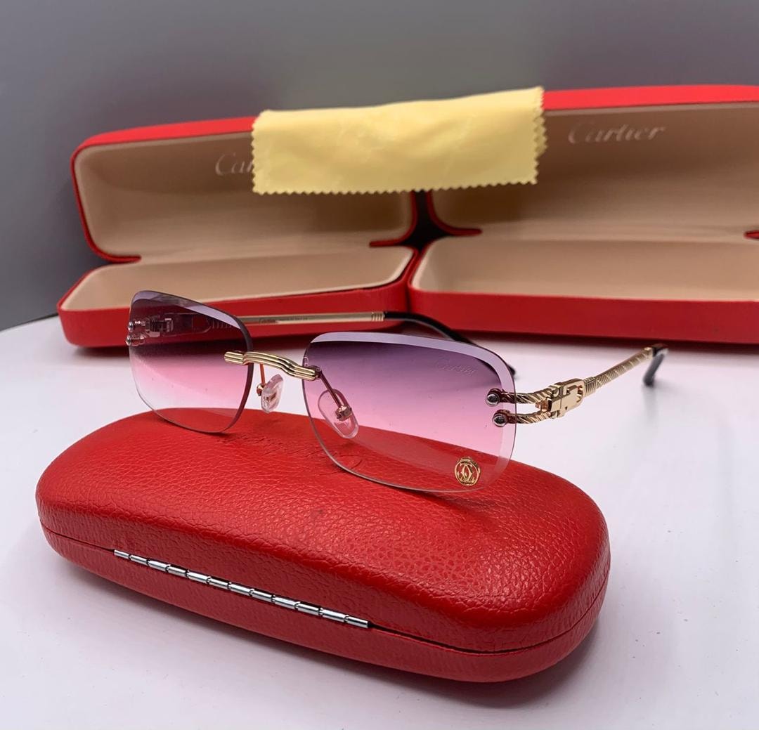 Cartier rimless sunglasses with purple pink gradient lenses and gold arms.