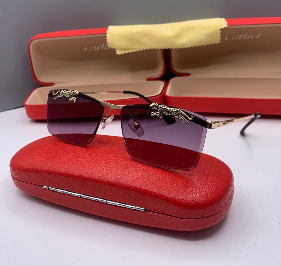 Cartier rimless glasses with dark purple gradient lenses and panther motif.
