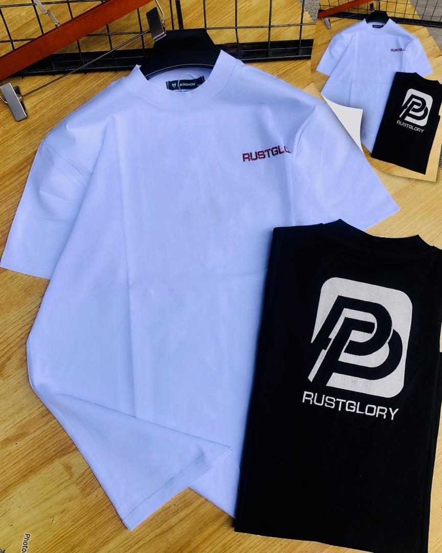 White and black Rustglory logo t-shirts with detail shots on wooden background.