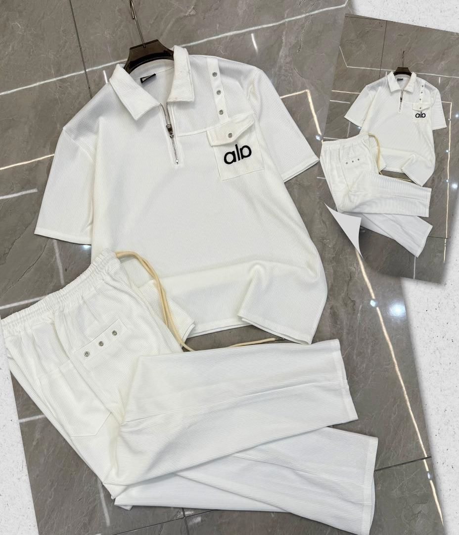 White Alo ribbed two-piece set with striped accents and logo.