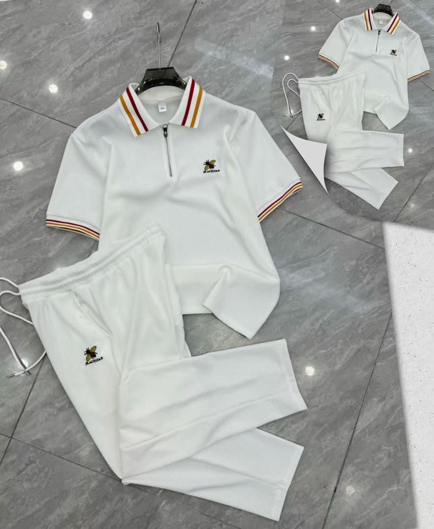 White Blackstar ribbed two-piece set with striped polo and pants.