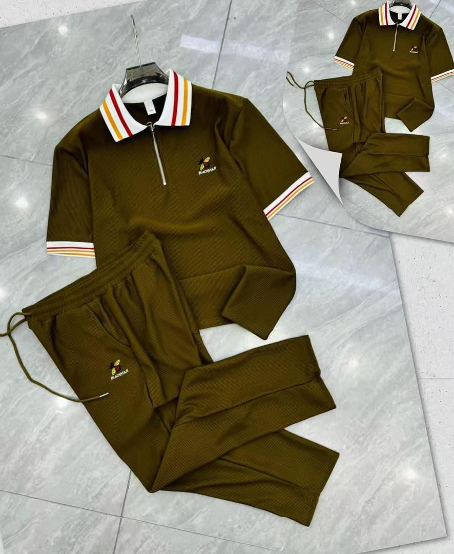 Olive Blackstar ribbed two-piece set with striped polo and pants on tiled floor.