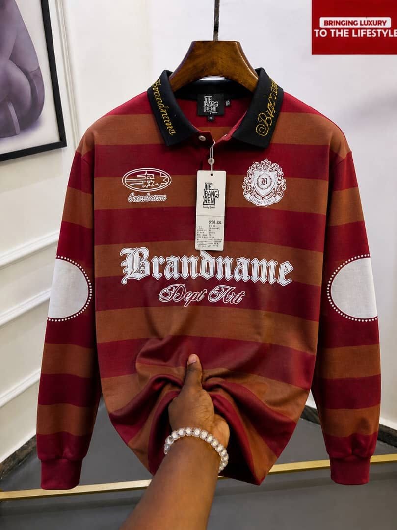 Red and brown striped long sleeve polo with black collar and Brandname embroidery.
