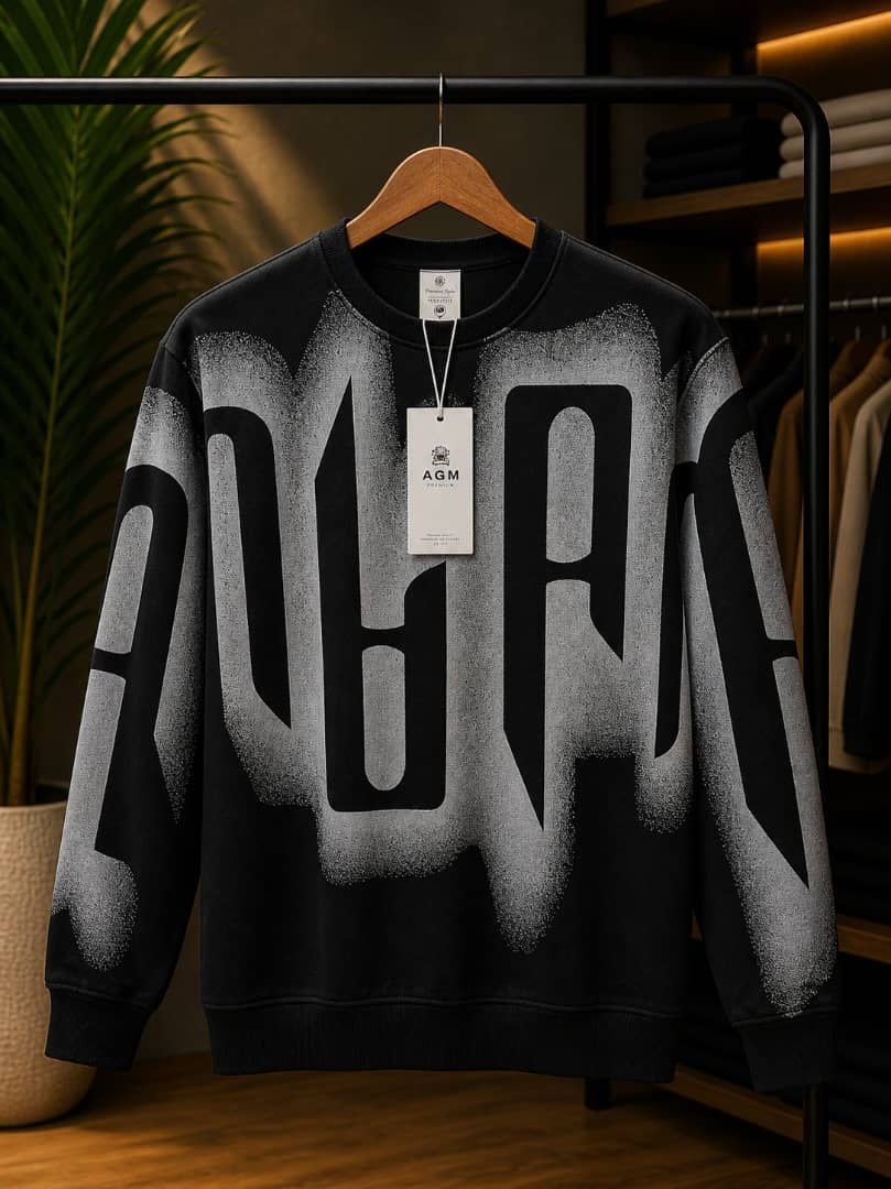 Black sweatshirt with white spray paint PARIS graphic.