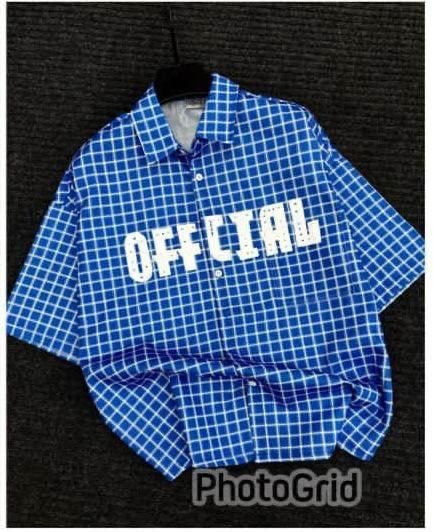 Blue checkered short sleeve shirt with OFFICIAL print on chest.