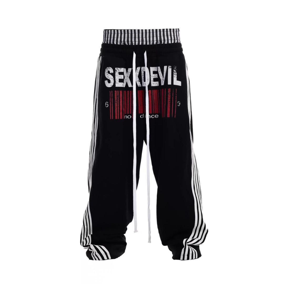 Black joggers with SEX DEVIL graphic, red barcode design, and white side stripes.