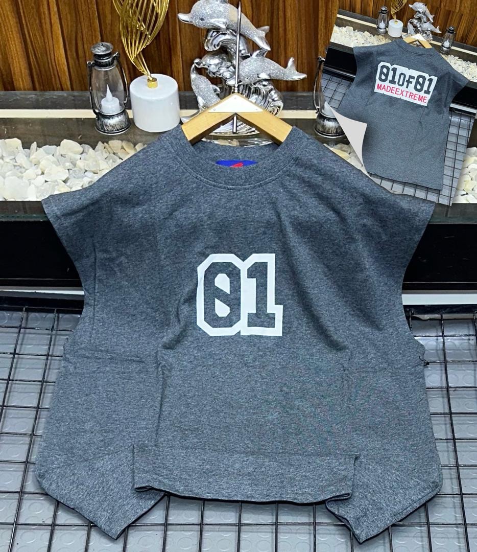 Grey oversized armless top with large white 01 graphic on chest.