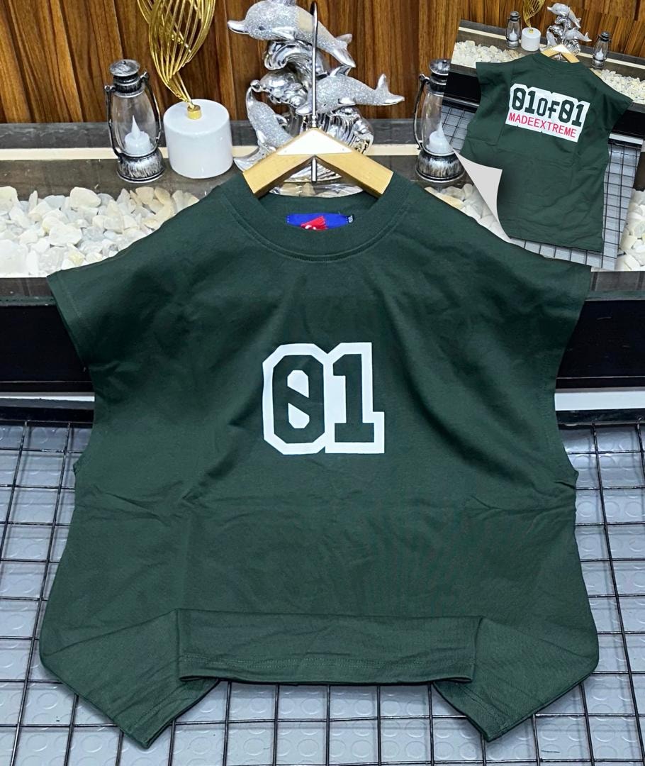 Green oversized armless top with large white 01 graphic on chest.