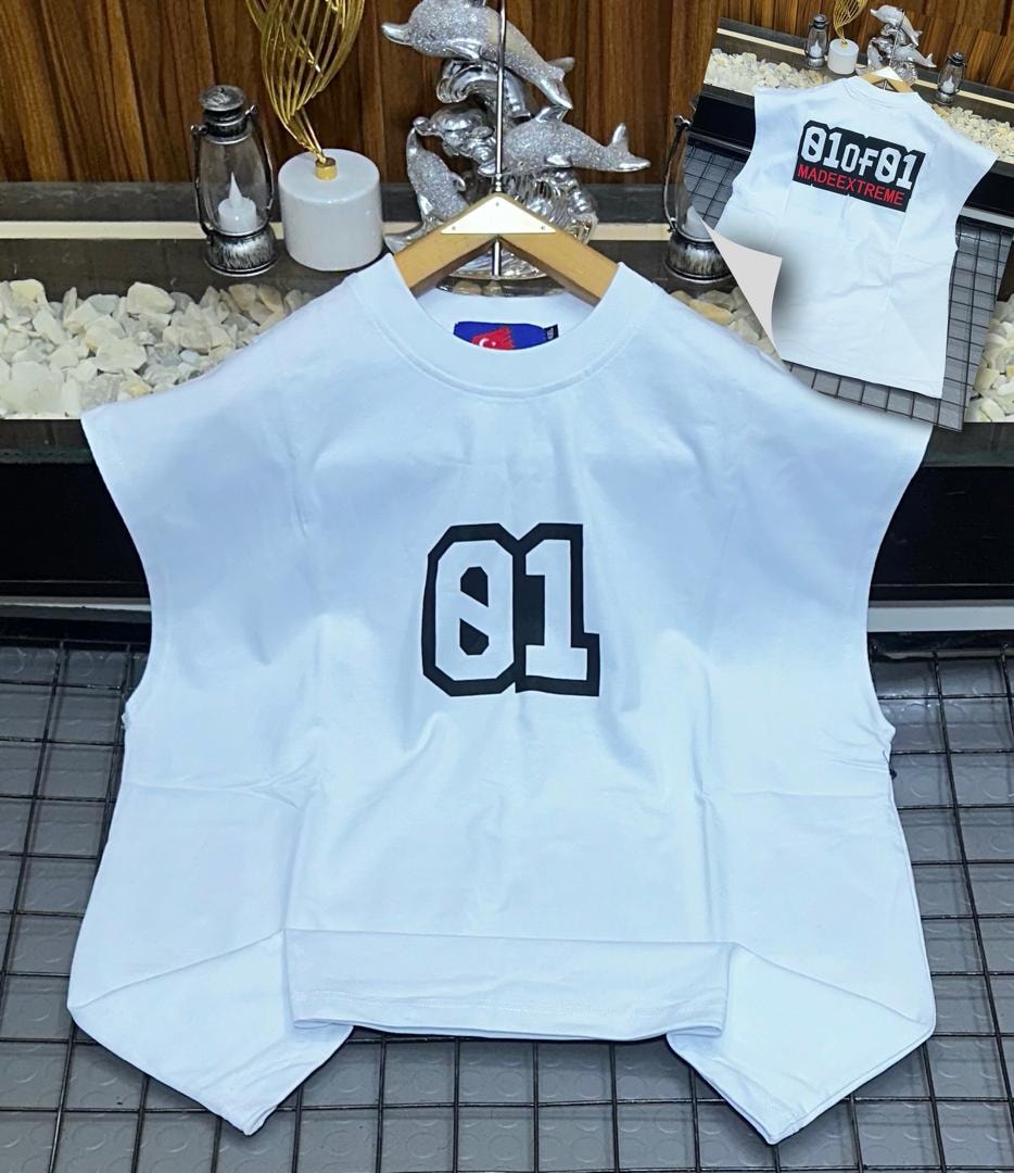 White oversized armless top with large black 01 graphic on chest.