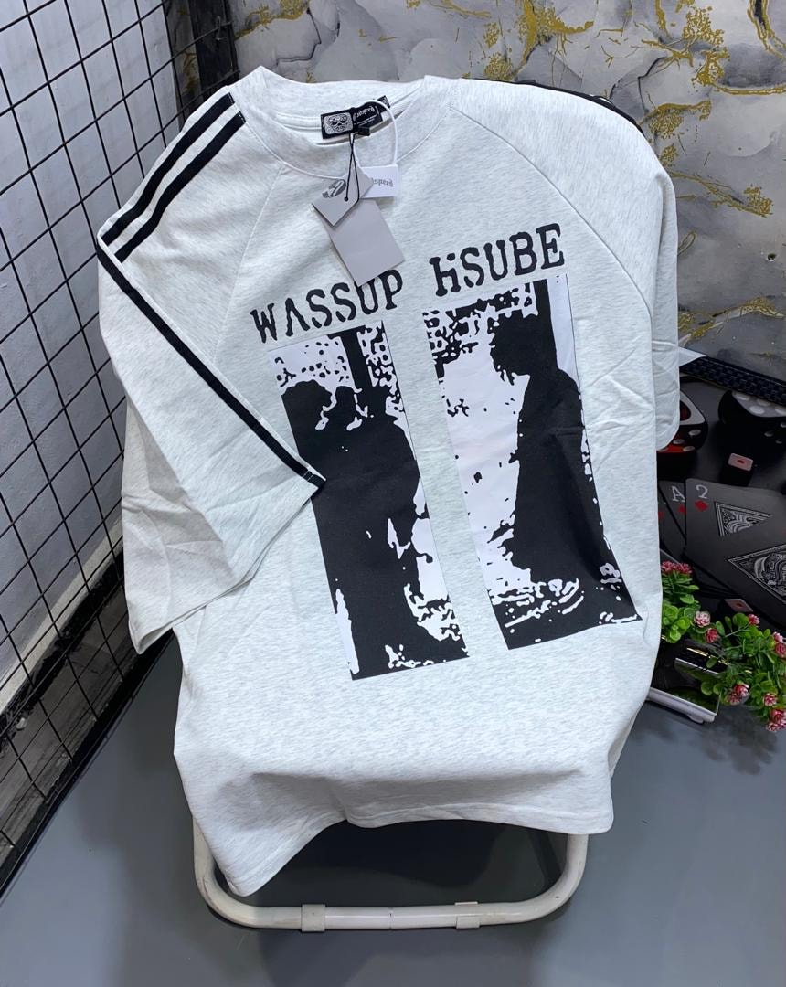 White unisex raglan t-shirt with black graphic print and striped sleeves.