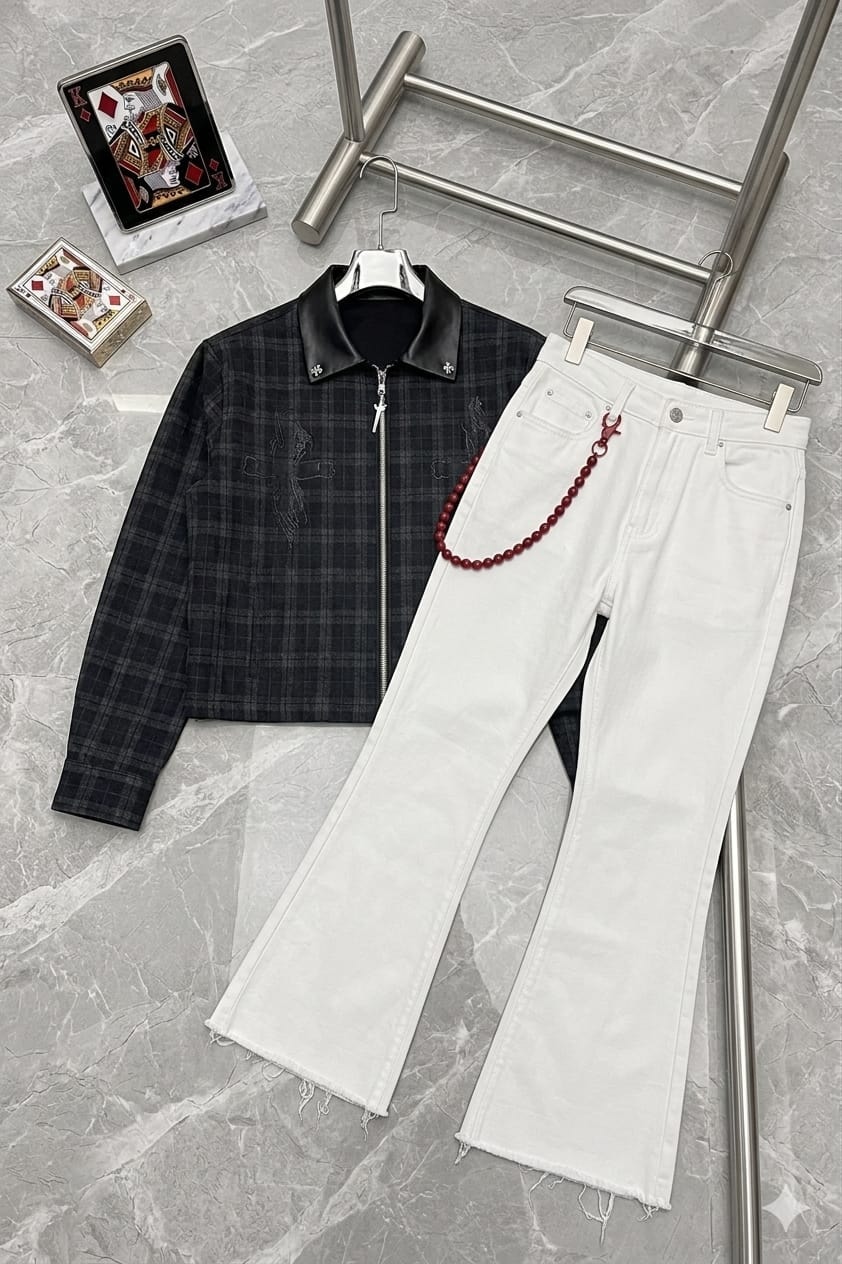 Black plaid zip-up jacket with leather collar paired with white flared jeans and red beaded chain.