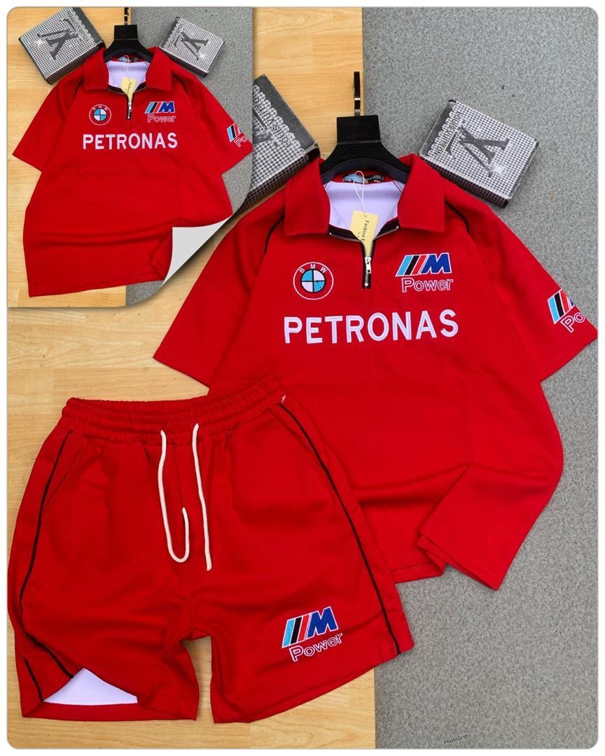 Red polo shirt and shorts set with PETRONAS BMW M Power racing graphics in studio display.