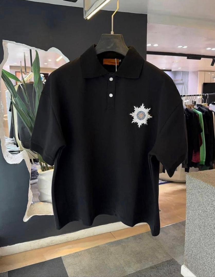 Black short-sleeve polo shirt with star embroidery on chest.