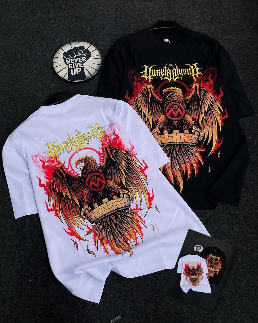 White and black t-shirts displaying fiery eagle graphic with text on front and back.