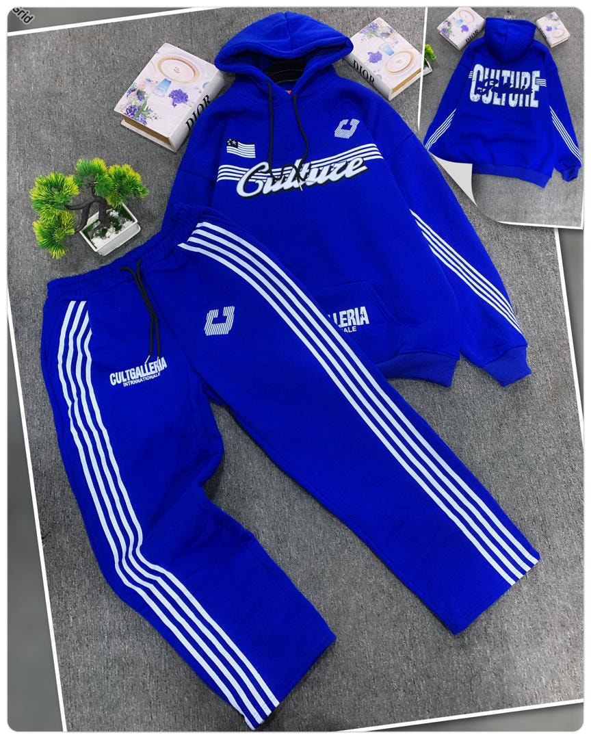 Blue oversized hoodie with Culture graphic and matching striped joggers.