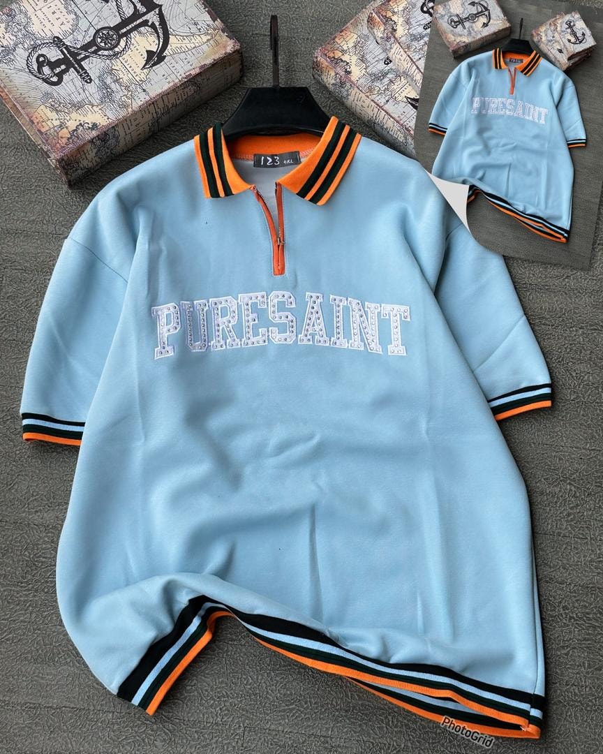 Light blue long sleeve Puresaint polo with striped trim and quarter zip.