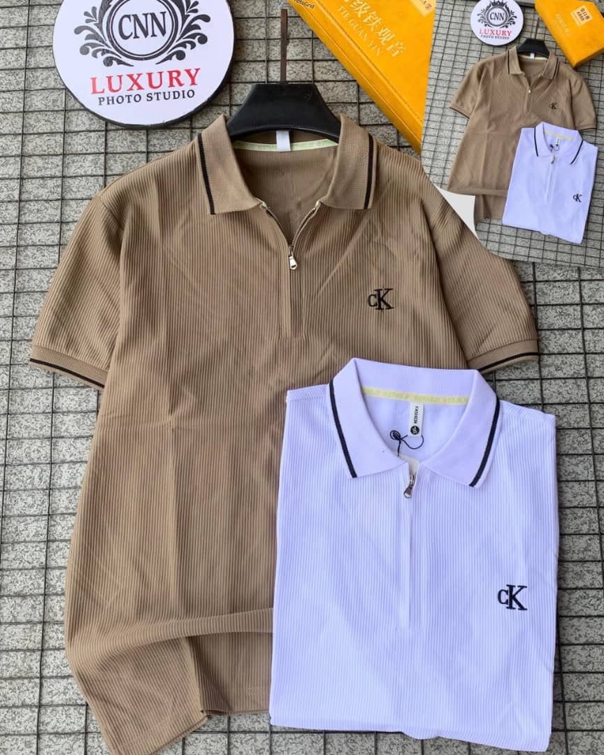Brown and white CK ribbed zip collar polos shown flat with studio signage and color insets.