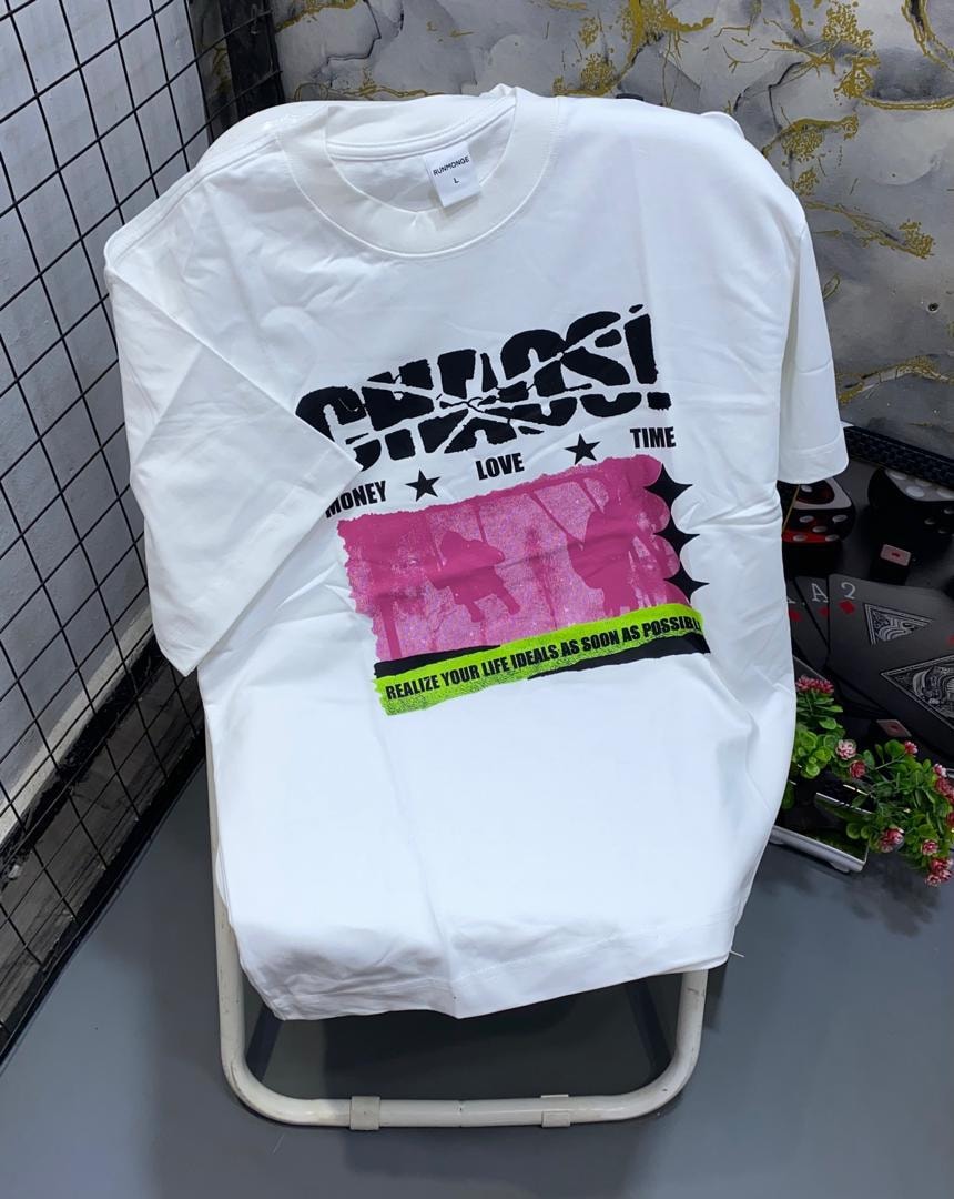 White t-shirt with black Chaos graphic, pink panel and motivational text.