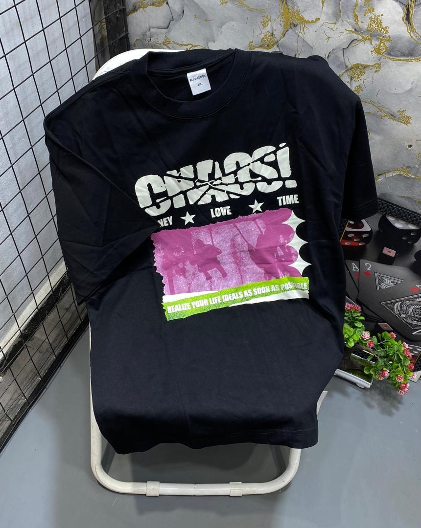 Black t-shirt with white Chaos graphic, pink panel and motivational text.