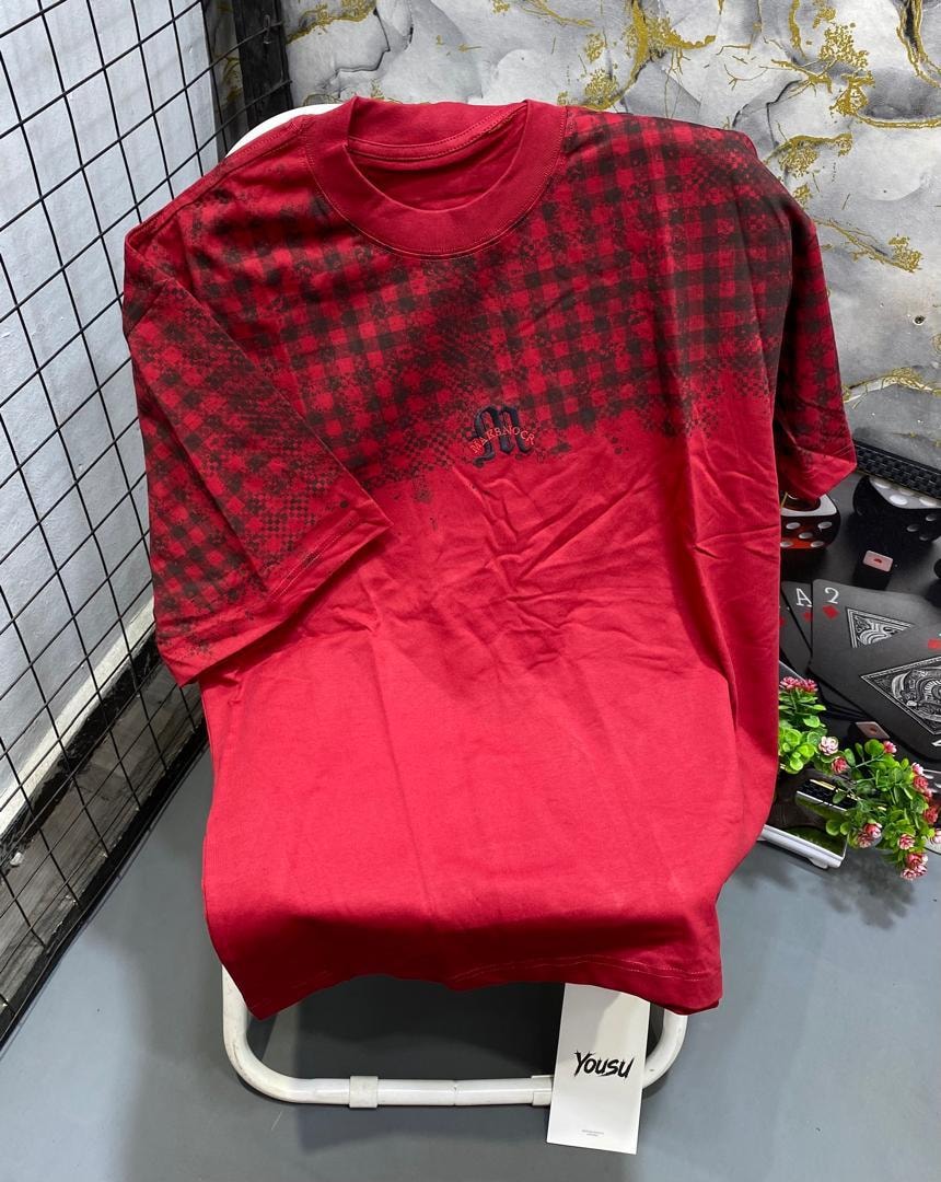 Red t-shirt with black checkered pattern on upper body and small chest logo.