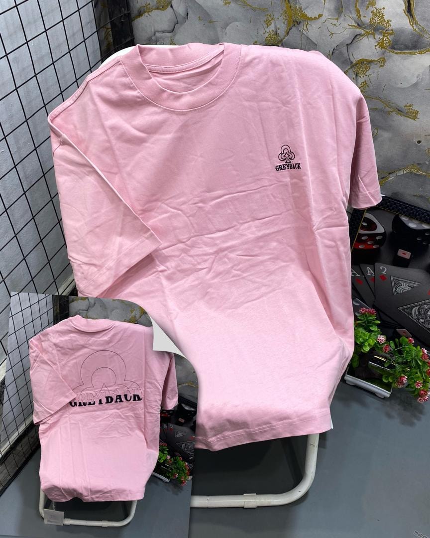 Front and back views of pink t-shirt with Greyback clover logo.