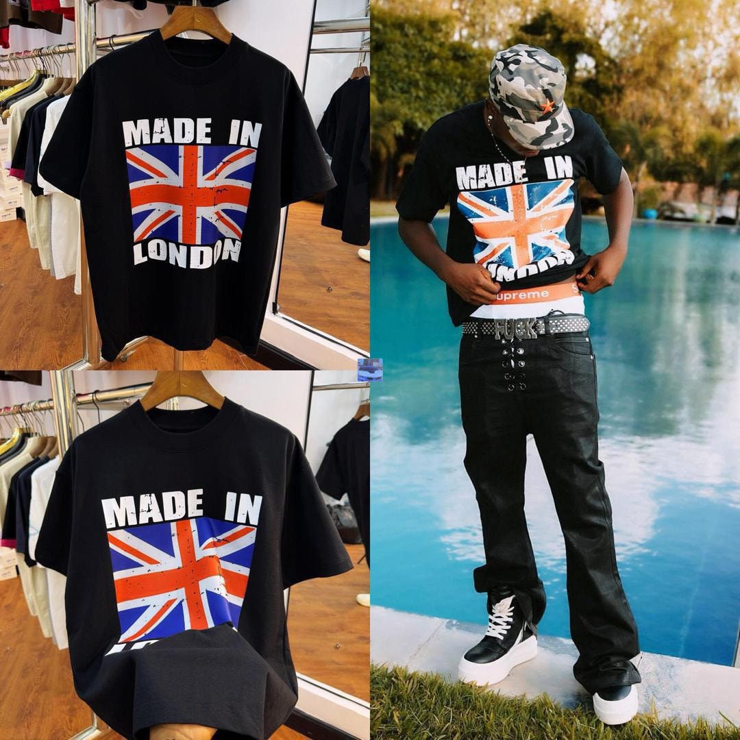 Black t-shirt with Made In London Union Jack graphic on hanger and worn by model by pool.