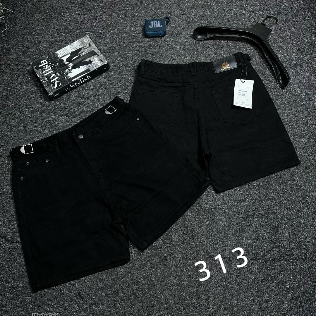 Black denim shorts shown in front and back views with accessories on dark background.