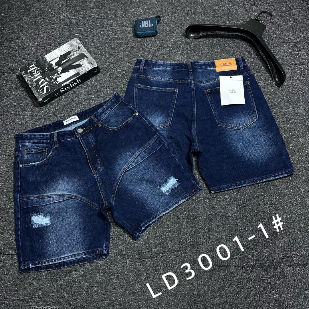 Blue denim shorts with panel seams, small rips and back view with accessories.