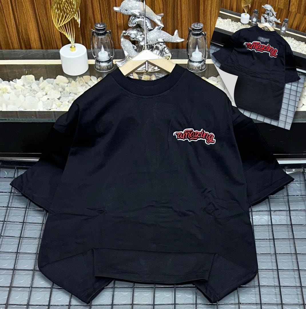 Black oversized polo shirt with red amazing embroidery on the chest, shown on hanger with back view inset.