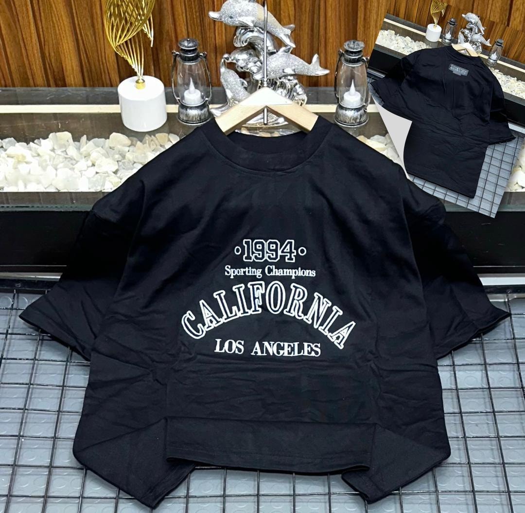 Black oversized t-shirt with 1994 California Los Angeles graphic print.