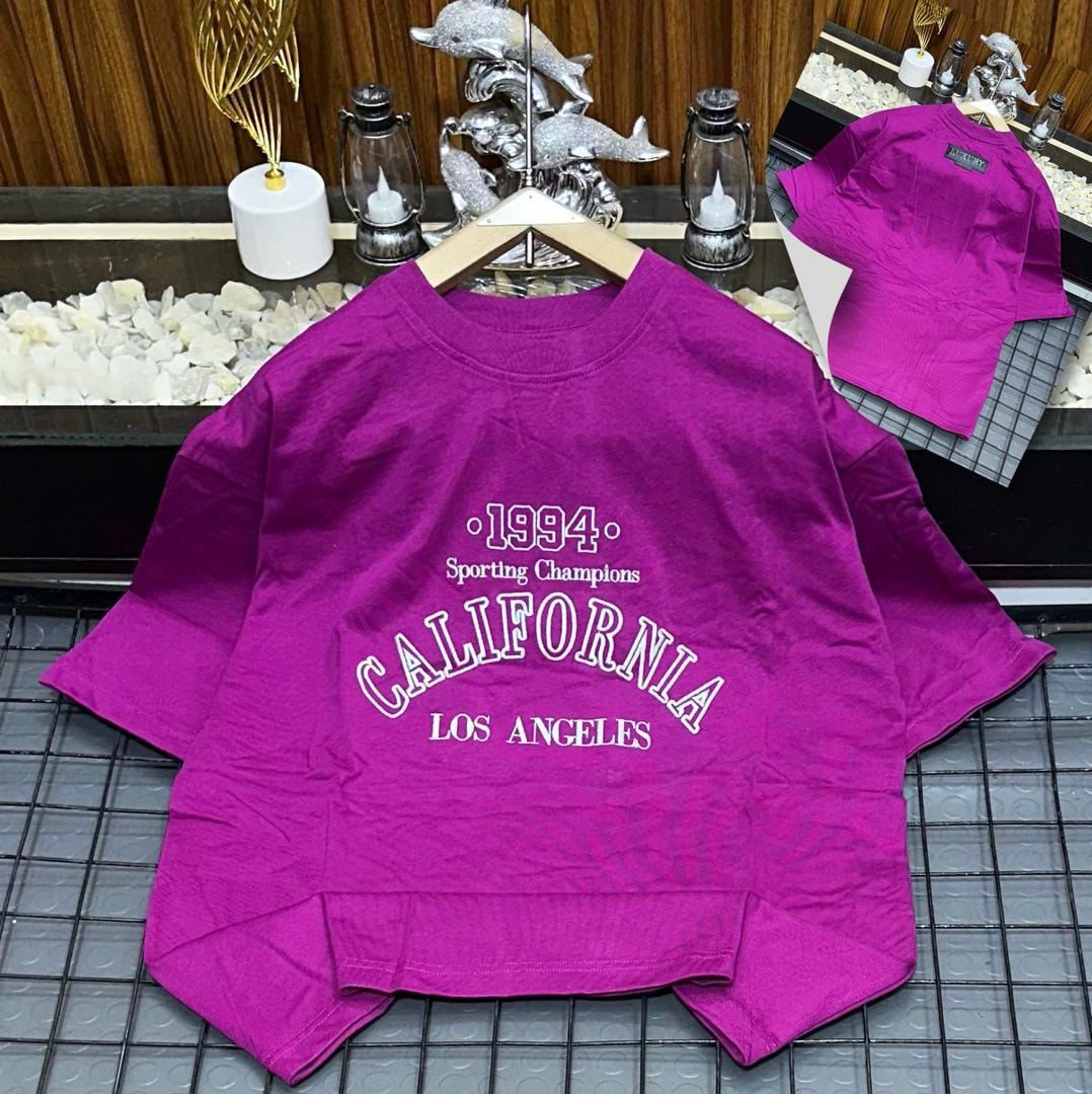 Purple oversized t-shirt with 1994 California Los Angeles graphic print.