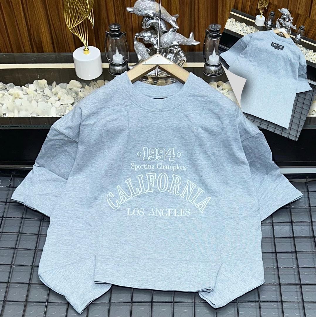 Gray oversized t-shirt with 1994 California Los Angeles graphic print.